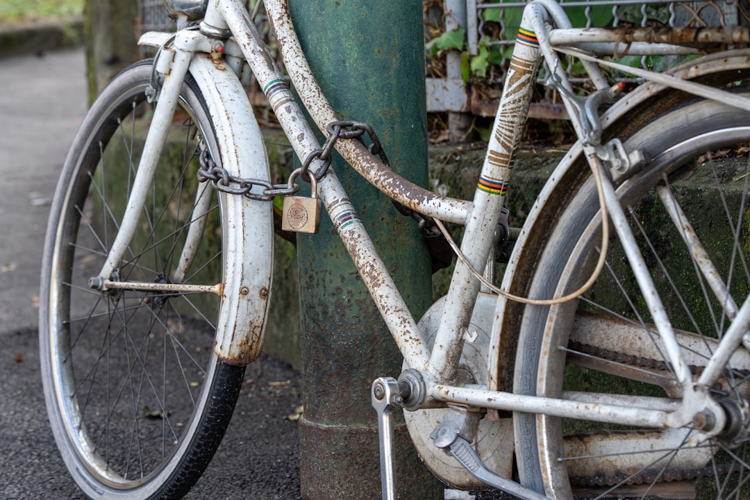 Bicycle locked on Amsterdam city street - Unsplash photo by Sirisvisual