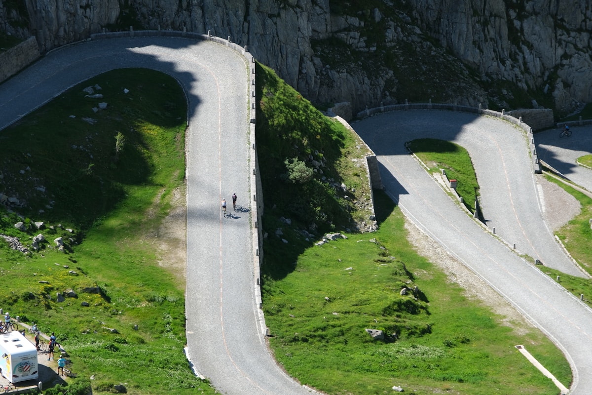 Cyclist navigating mountain switchback road