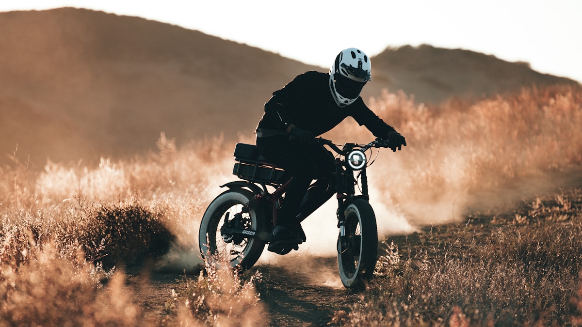 Electric bike rider adventuring through mountains - DOMI eBike Guide