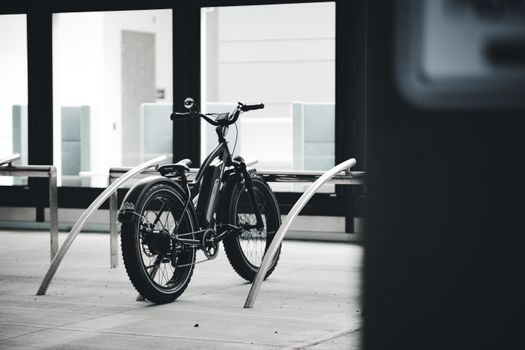 Electric bike parked at modern office building