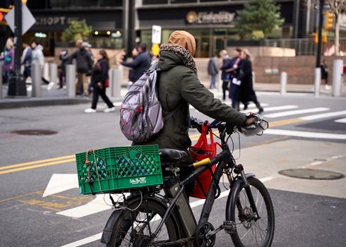 eBike rider passing car traffic in European city